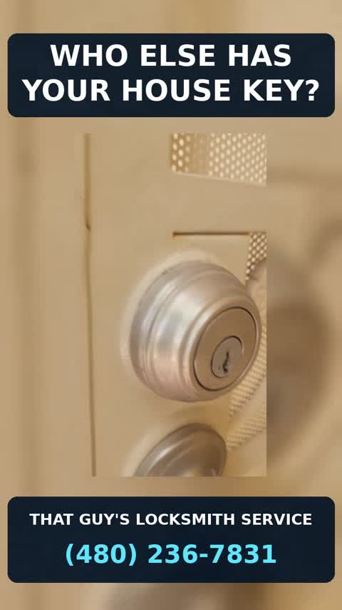 Residential locksmith rekeying a door lock